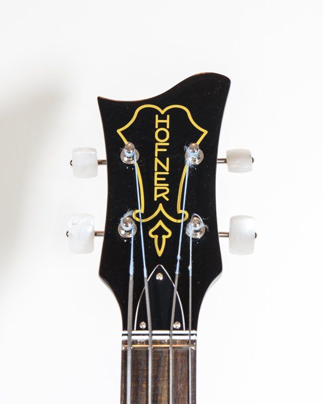 The headstock of a hofner guitar is shown