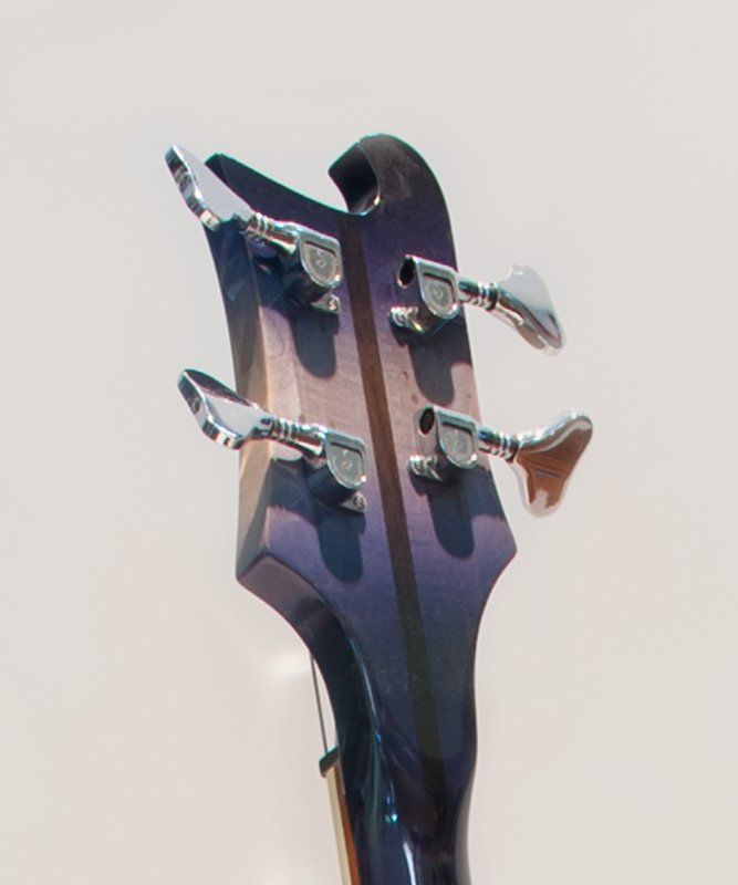 A close up of the headstock of a guitar
