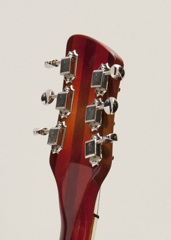 A close up of the headstock of a guitar