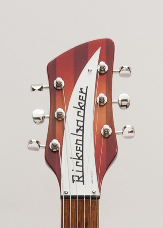 A close up of a rickenbacker guitar headstock