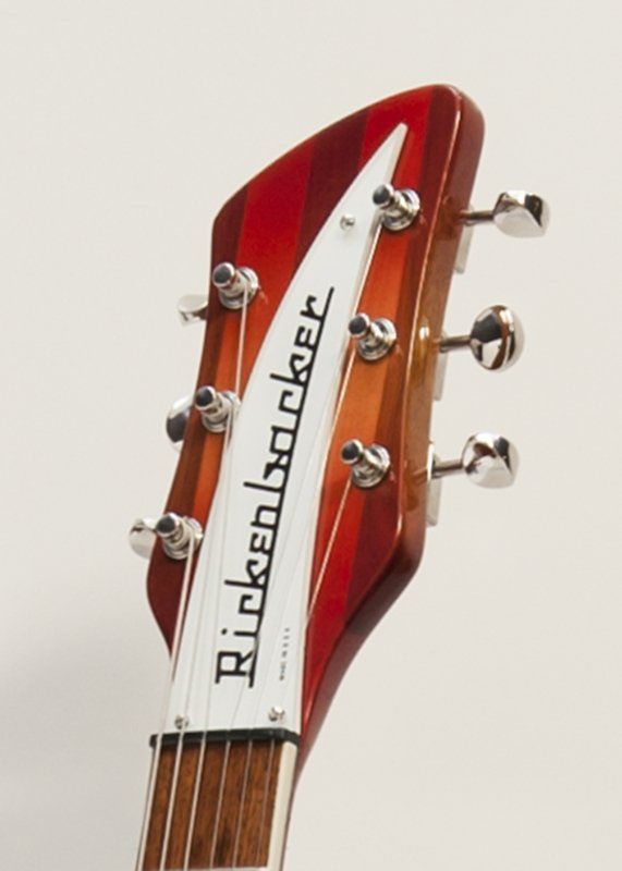 A close up of a rickenbacker guitar headstock