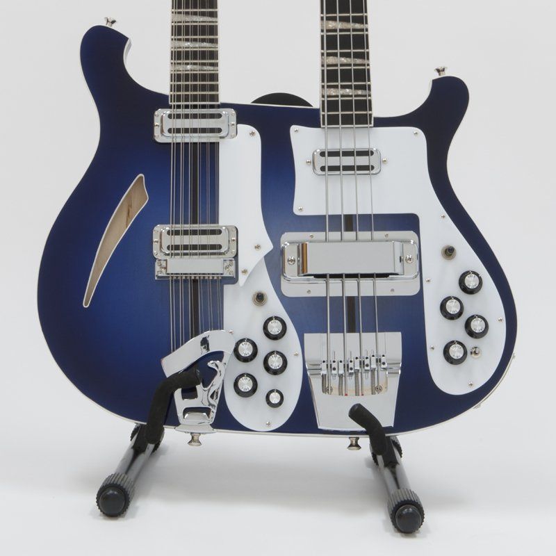 A blue and white double neck guitar on a stand