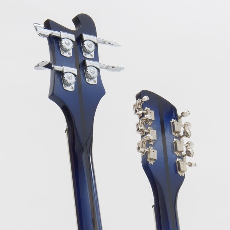 A close up of the headstock of a blue guitar