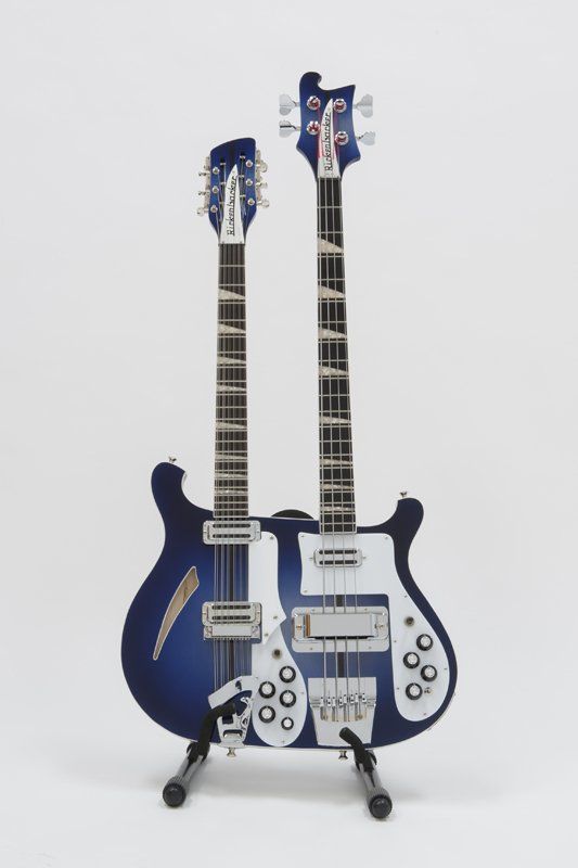 A blue and white double neck guitar on a stand