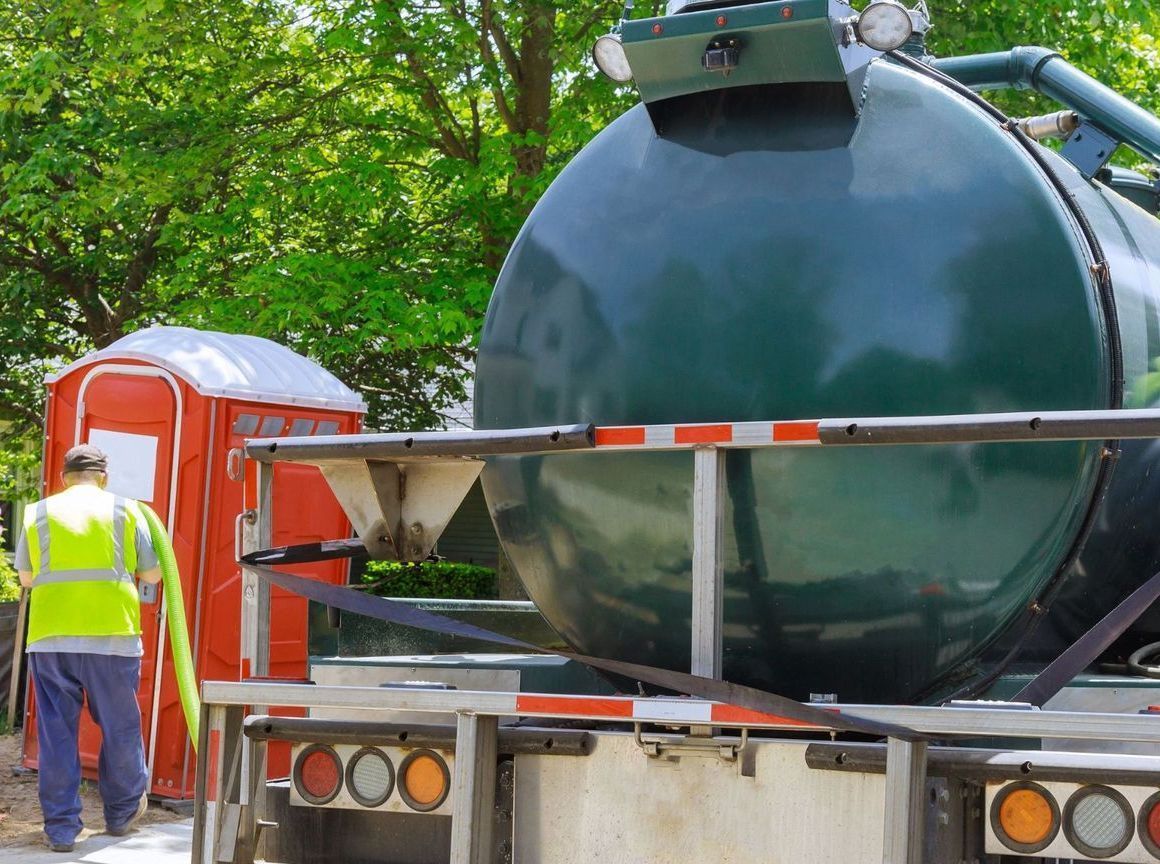 Photo of pump truck from Septic Masters at a residential location.