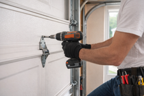 Technician installing bracket on garage door panel