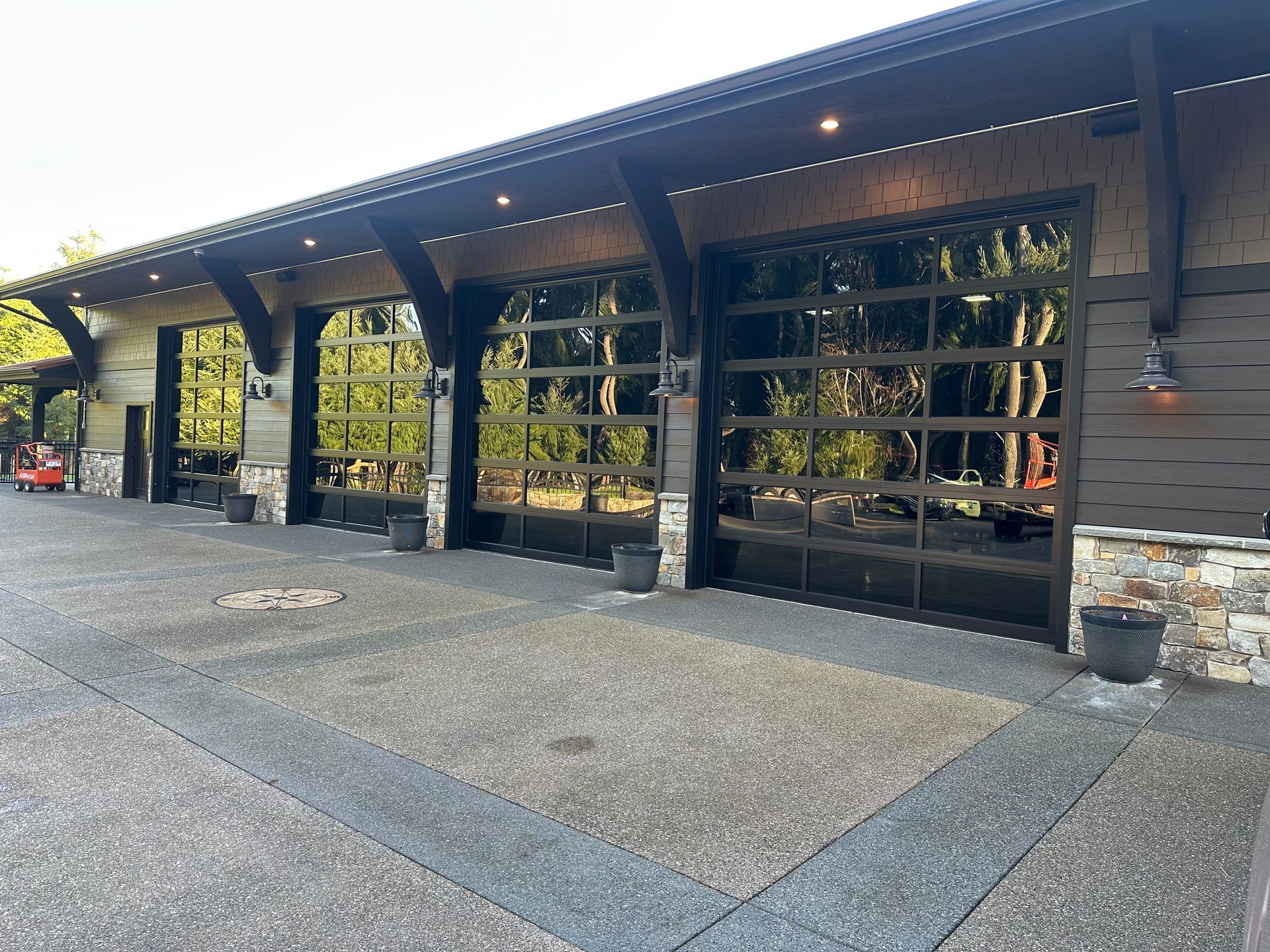 Modern commercial glass garage doors on covered exterior structure