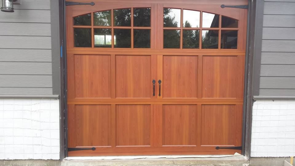 Modern classic single car garage door installation performed by Johnson & Johnson Overhead Door INC