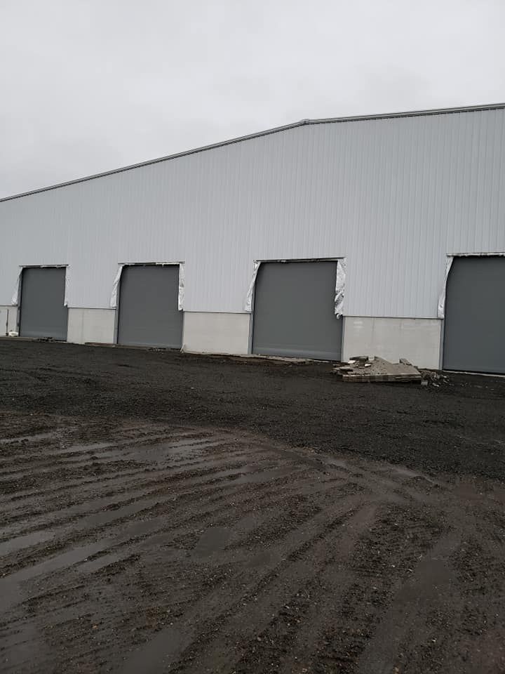 Large commercial garage door installation in Lewis County, WA performed by Johnson & Johnson Overhead Door INC