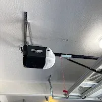 Installed garage door opener by Johnson & Johnson Overhead Door INC