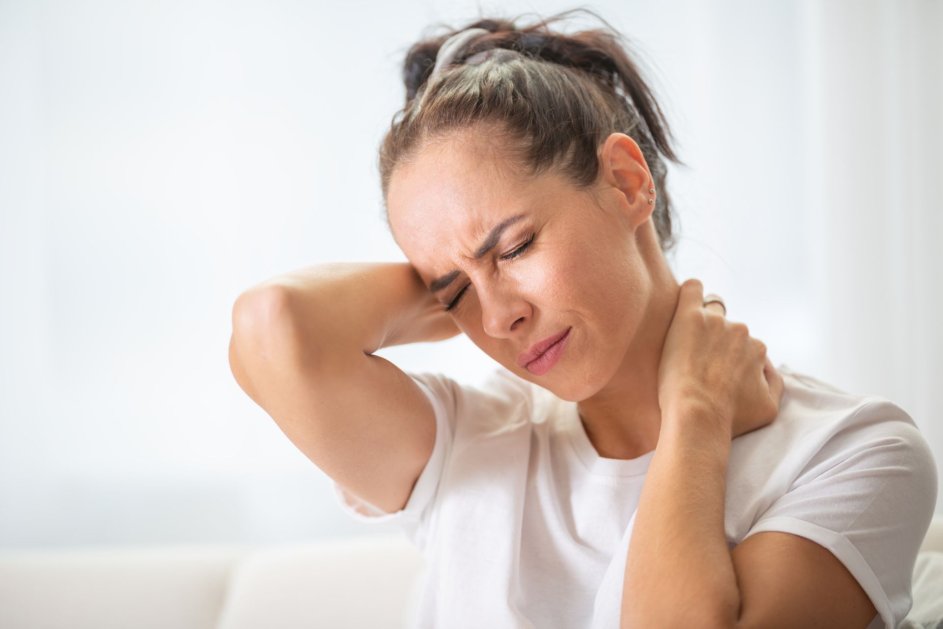 Woman with Neck Pain — Abingdon, VA — Law Offices of Michael R. Munsey, P.C.