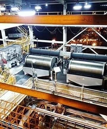 A Large Machine is Sitting on Top of a Building at Night — KBX Mechanical In Mackay, QLD