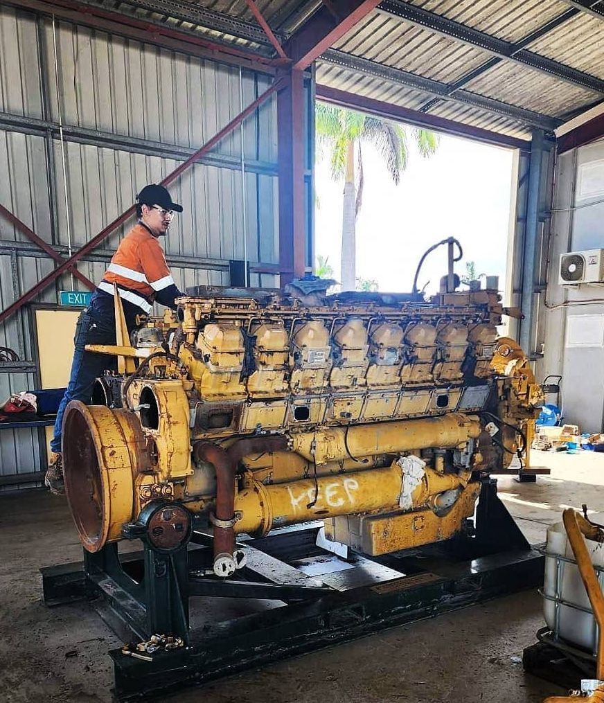A Mechanic Is Working On An Engine— KBX Mechanical In Mackay, QLD
