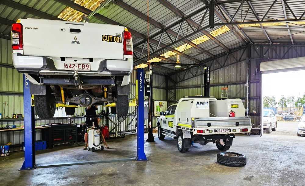 A Truck Is Sitting On A Lift In A Garage — KBX Mechanical In Mackay, QLD