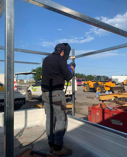 A Man Is Welding In A Ute — KBX Mechanical In Mackay, QLD