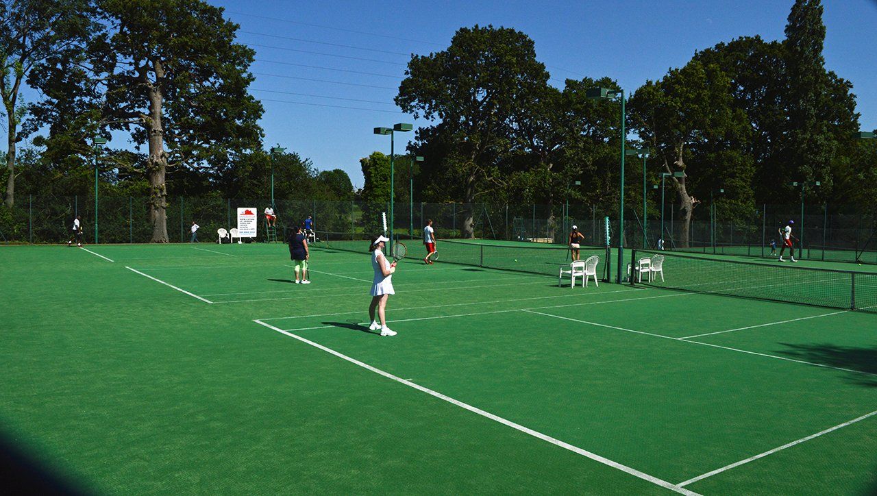 An image of tennis players at Pinner Lawn Tennis Club