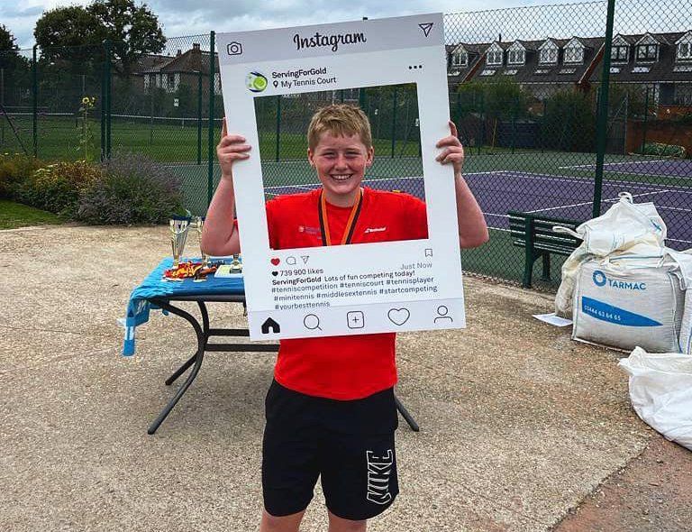 An image of a tennis player holding an Instagram banner