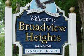A Blue and white sign that reads welcome to broadview heights