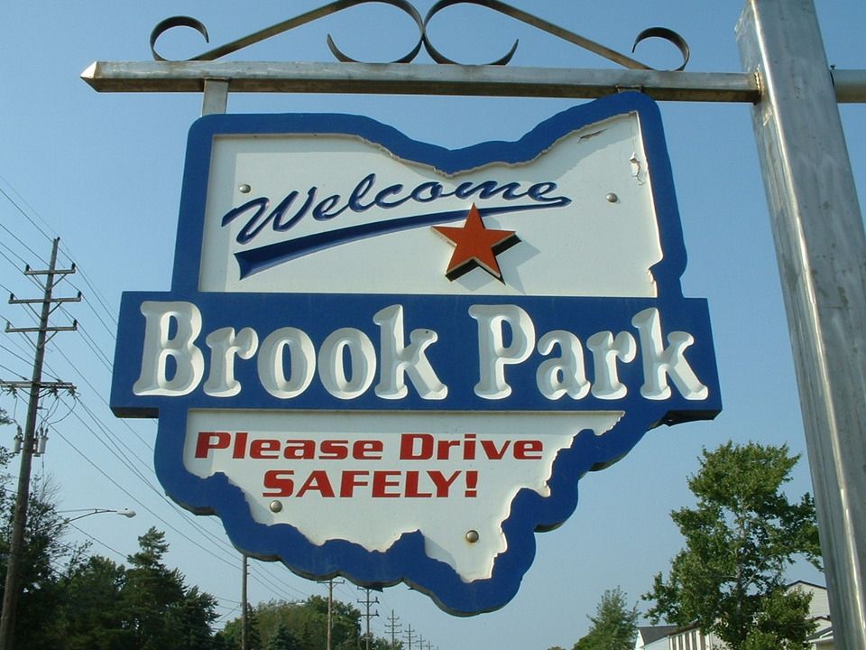 A Sign That says welcome to brook park please drive safely