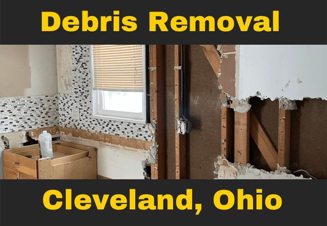a kitchen under construction and is missing plaster on walls caption reads debris removal cleveland, ohio