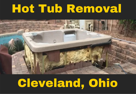 hot tub in a backyard that is missing its front panel with text that reads hot tub removal cleveland, ohio