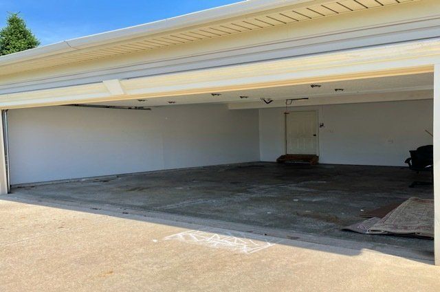 empty garage with front door open