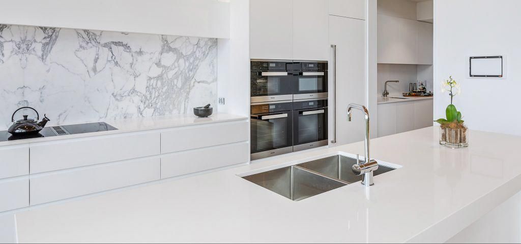 A Kitchen With White Cabinets And A Stainless Steel Sink — Viison Kitchens & Joinery Forster In Forster, NSW