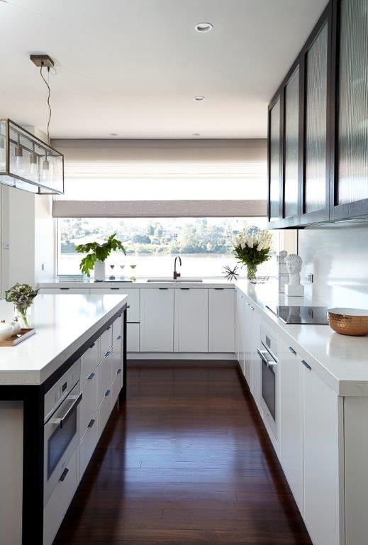 A Kitchen With White Cabinets And A Large Window — Viison Kitchens & Joinery Forster In Forster, NSW