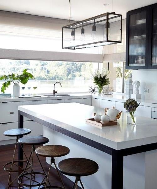 A kitchen with a large island and stools — Viison Kitchens & Joinery Forster In Forster, NSW