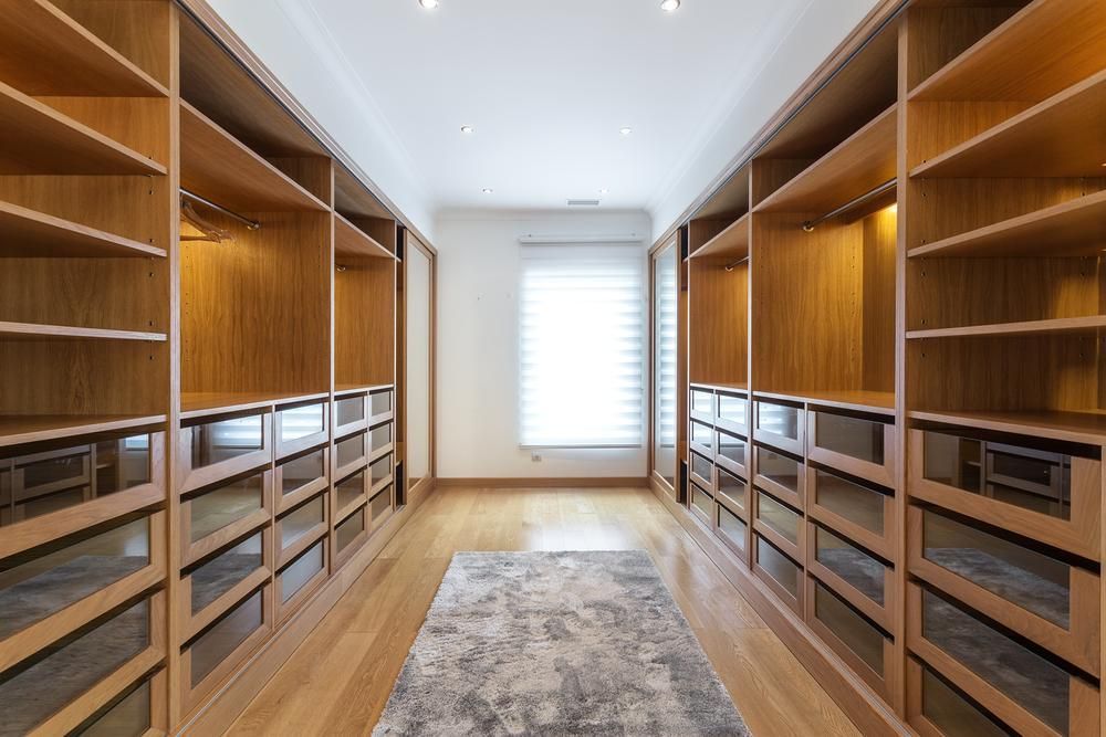 A Large Walk In Closet With Lots Of Shelves And Drawers — Viison Kitchens & Joinery Forster In Gloucester, NSW