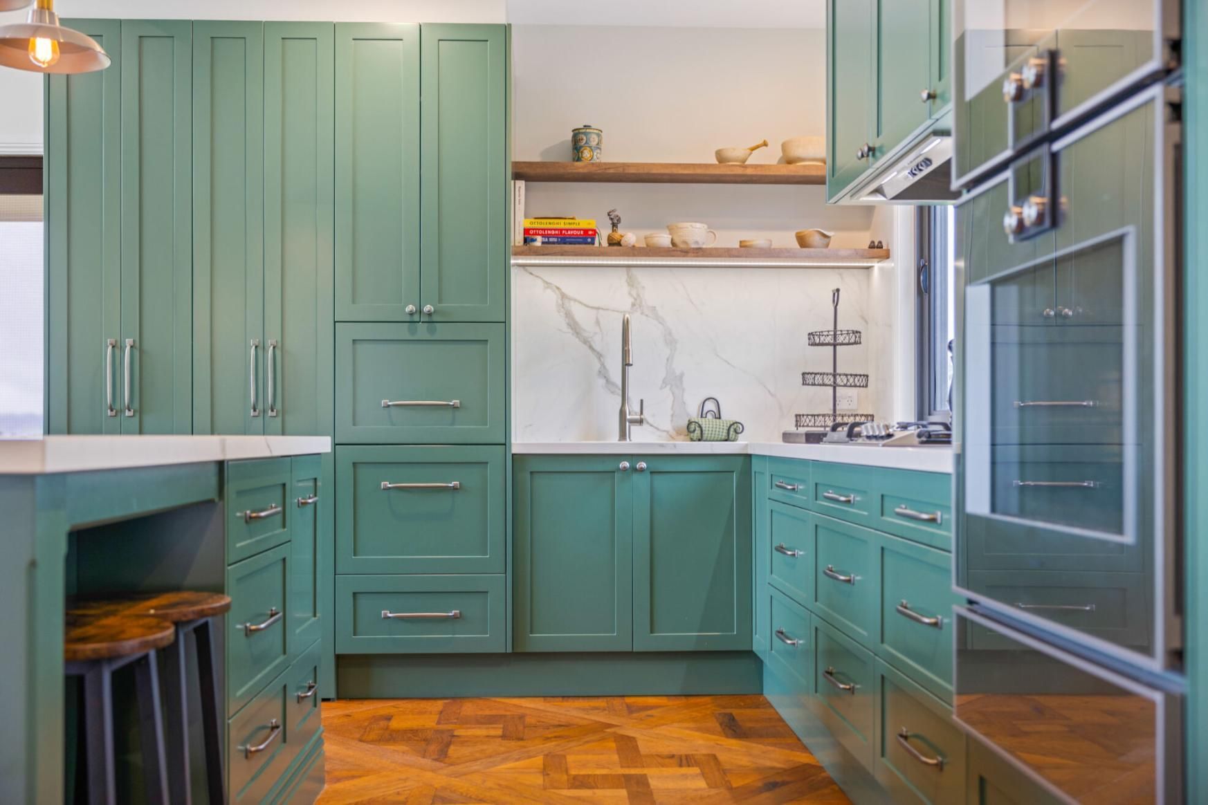 A Kitchen With Green Cabinets And Stainless Steel Appliances — Viison Kitchens & Joinery Forster In Forster, NSW