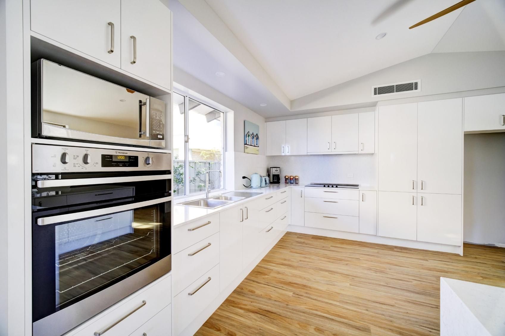 A Kitchen With White Cabinetry — Viison Kitchens & Joinery Forster In Forster, NSW