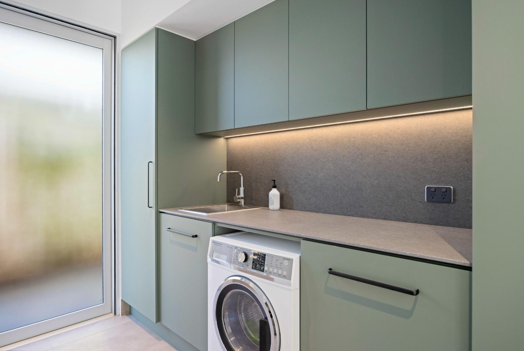 A Laundry Room With A Washing Machine And A Sink — Viison Kitchens & Joinery Forster In Forster, NSW