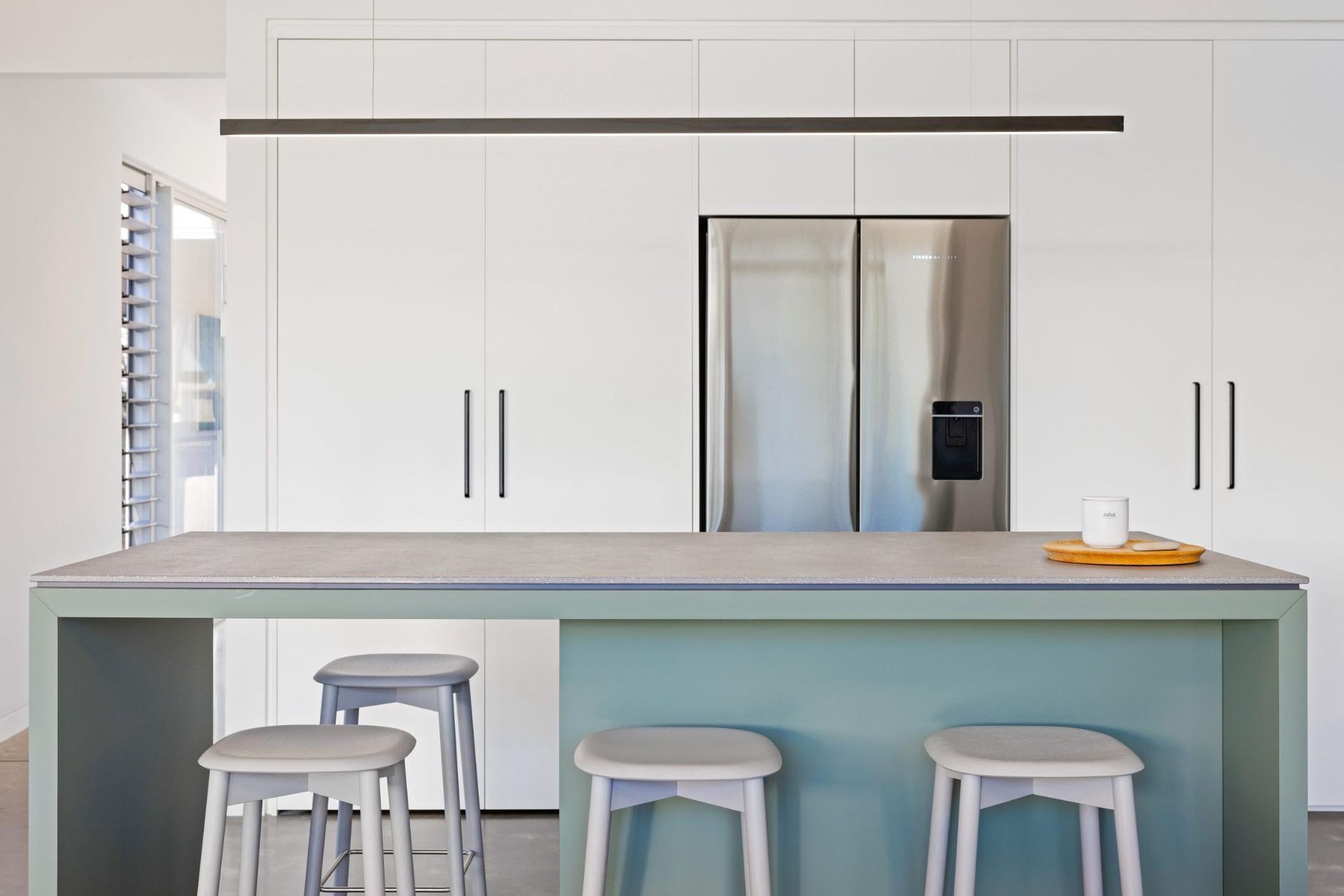 A Kitchen With White Cabinets And A Stainless Steel Refrigerator — Viison Kitchens & Joinery Forster In Forster, NSW