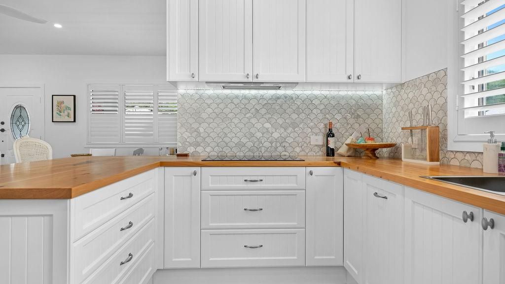 A Kitchen With White Cabinets And Wooden Counter Tops — Viison Kitchens & Joinery Forster In Forster, NSW