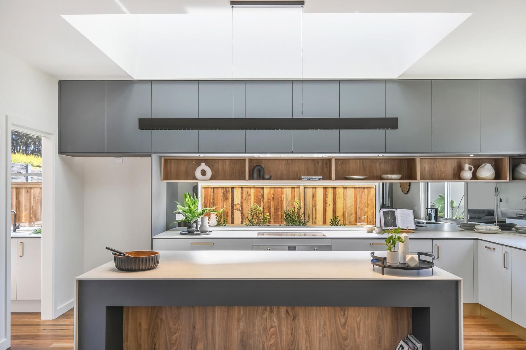 A Kitchen With A Large Island In The Middle Of It — Viison Kitchens & Joinery Forster In Bulahdelah, NSW