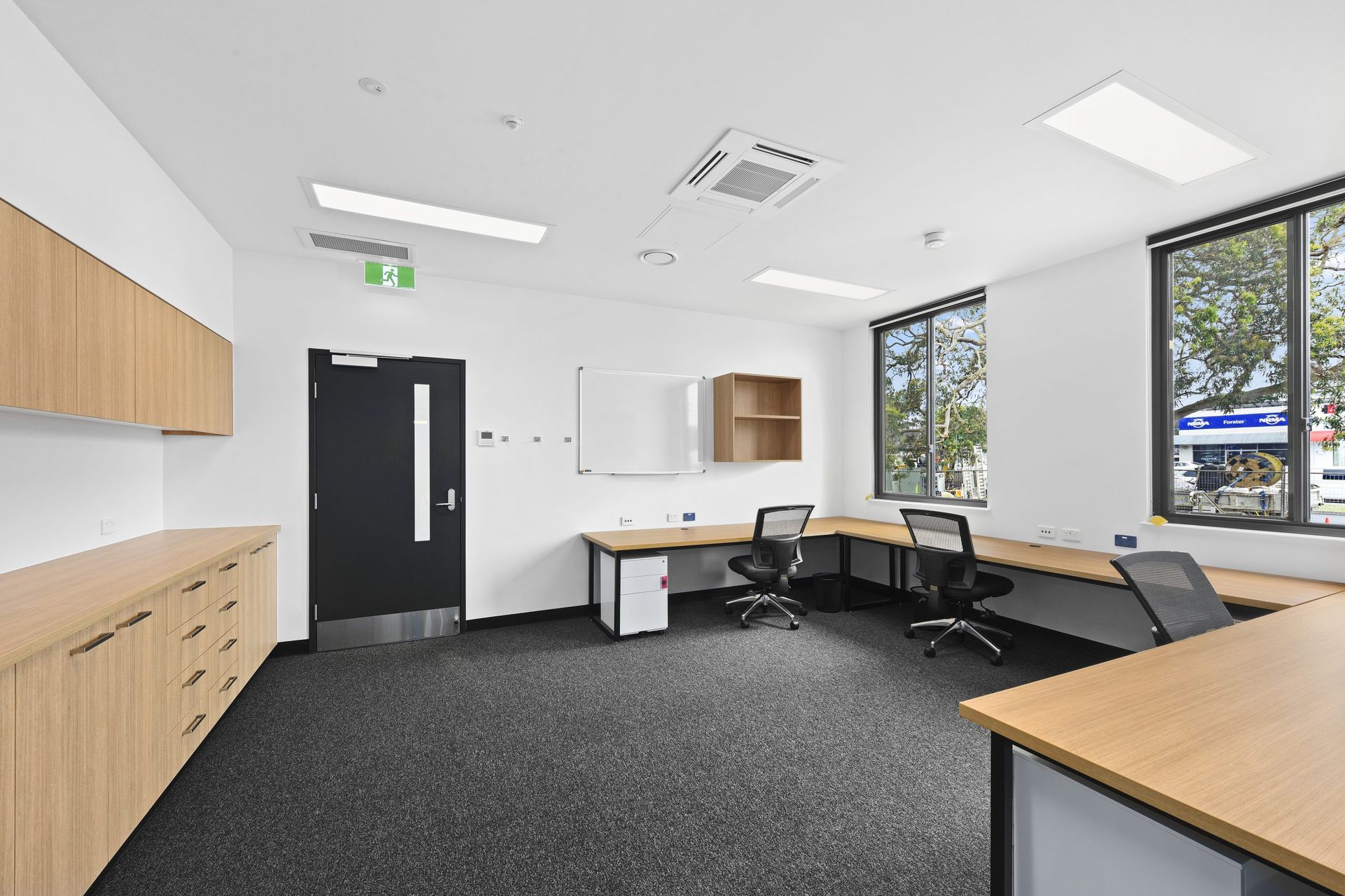 A Large Open Office With Lots Of Desks And Chairs — Viison Kitchens & Joinery Forster In Forster, NSW