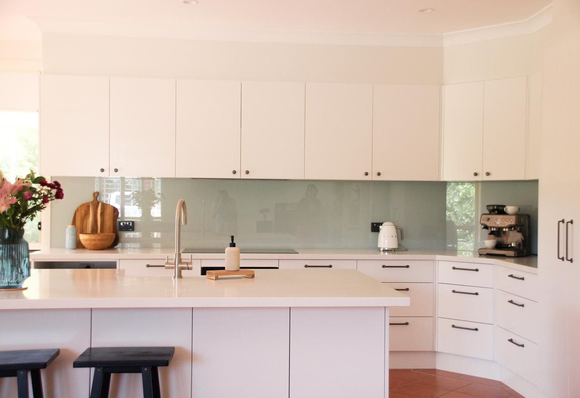 A Kitchen With White Cabinets And A Large Island In The Middle — Viison Kitchens & Joinery Forster In Taree, NSW
