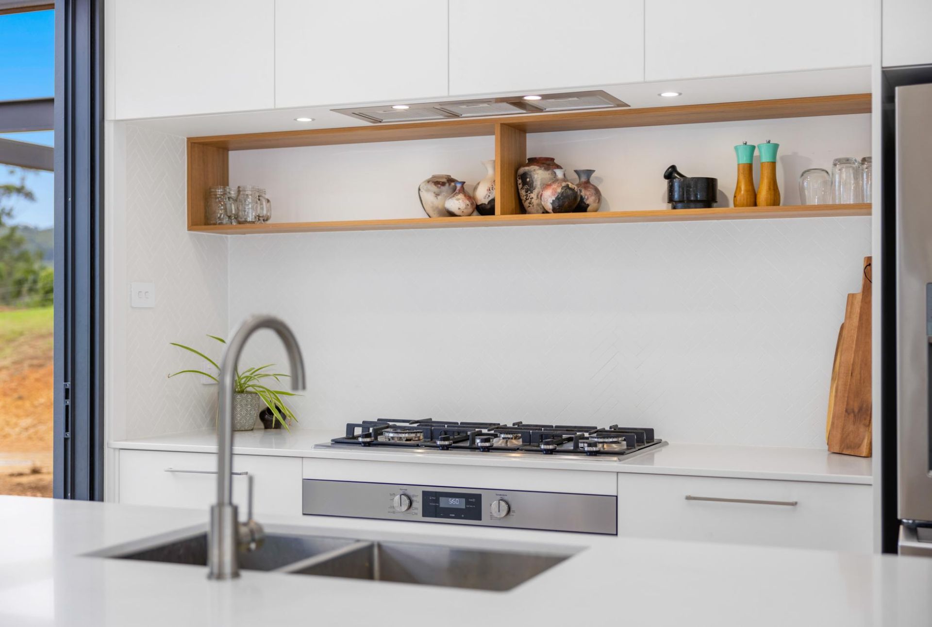A Kitchen With Two Sinks And A Stove Top Oven — Viison Kitchens & Joinery Forster In Wingham, NSW