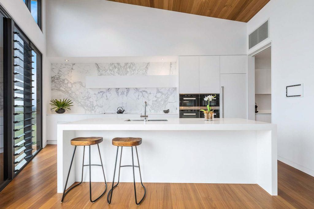 A Kitchen With A Large Island And Two Stools — Viison Kitchens & Joinery Forster In Forster, NSW