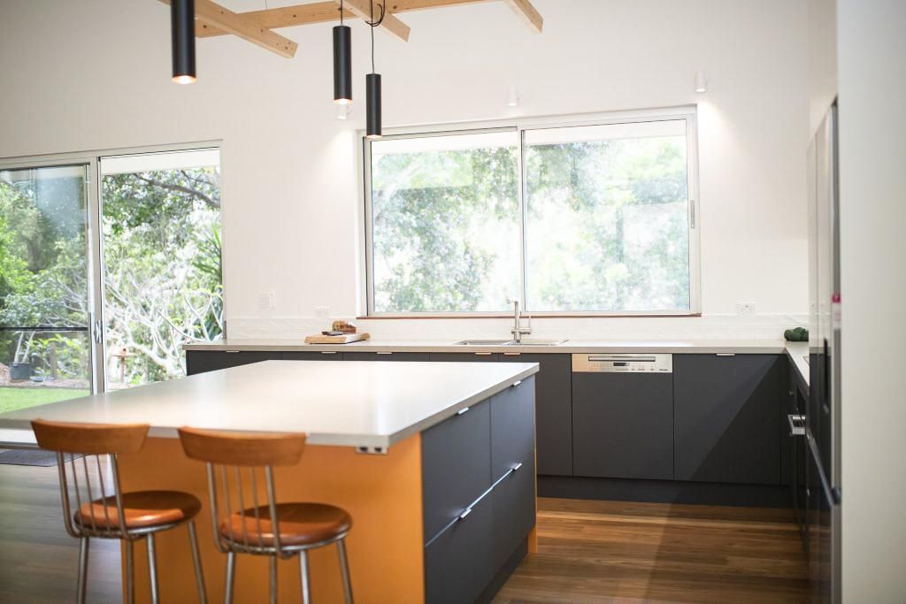 A Kitchen With A Large Island And Stools And A Large Window — Viison Kitchens & Joinery Forster In Forster, NSW