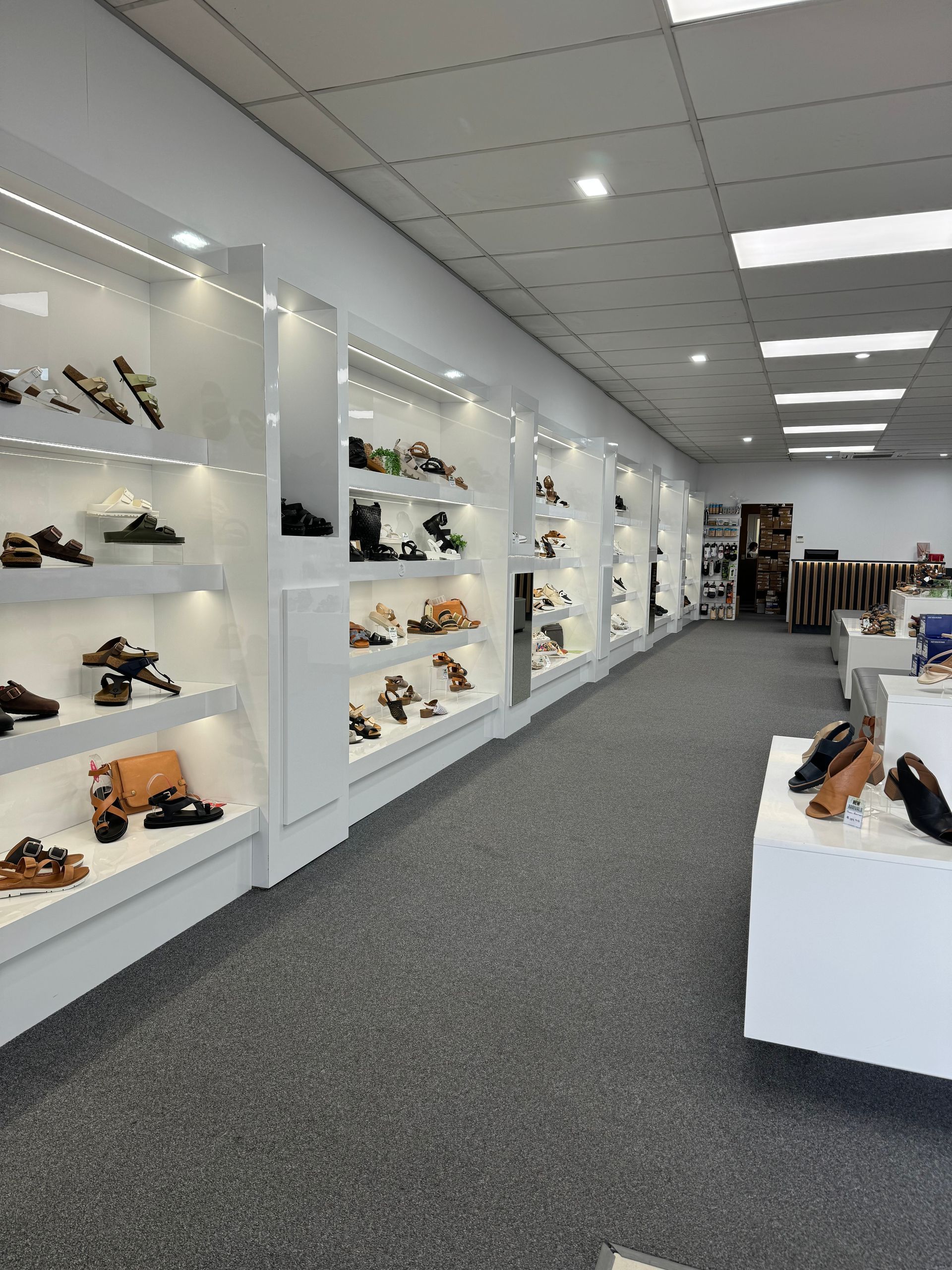 A Large Shoe Shop With Shelves Of Shoes — Viison Kitchens & Joinery Forster In Forster, NSW