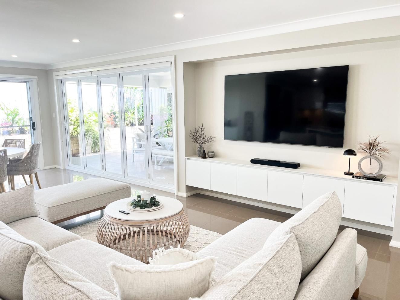 A Living Room Filled With Furniture And A Flat Screen Tv — Viison Kitchens & Joinery Forster In Old Bar, NSW