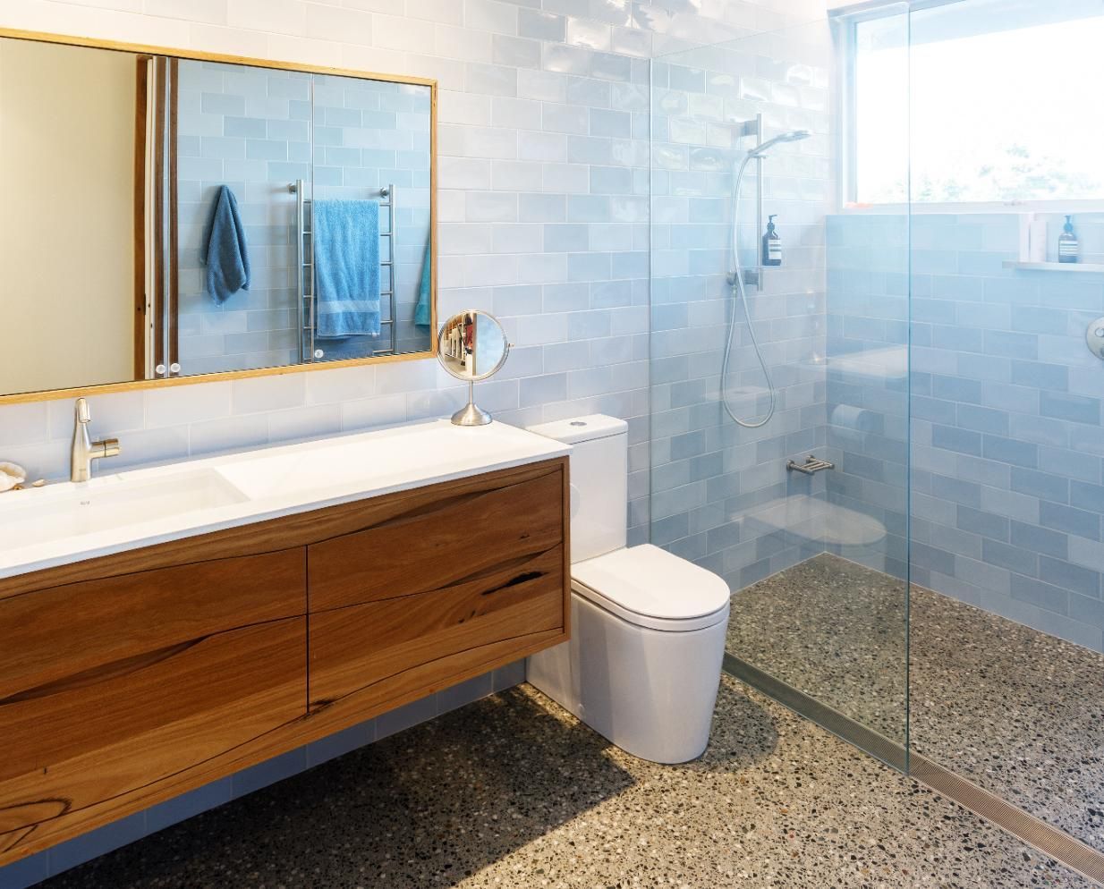 A Bathroom With A Toilet , Sink , Mirror And Walk In Shower — Viison Kitchens & Joinery Forster In Forster, NSW
