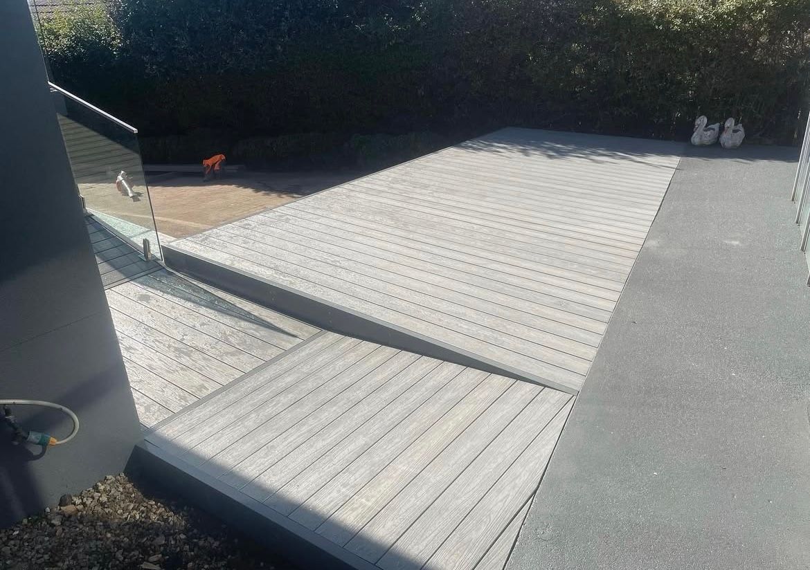 Gray ramp leading down from a vehicle. Wooden plank design with texture. — Hallam & Sons in Beard, ACT