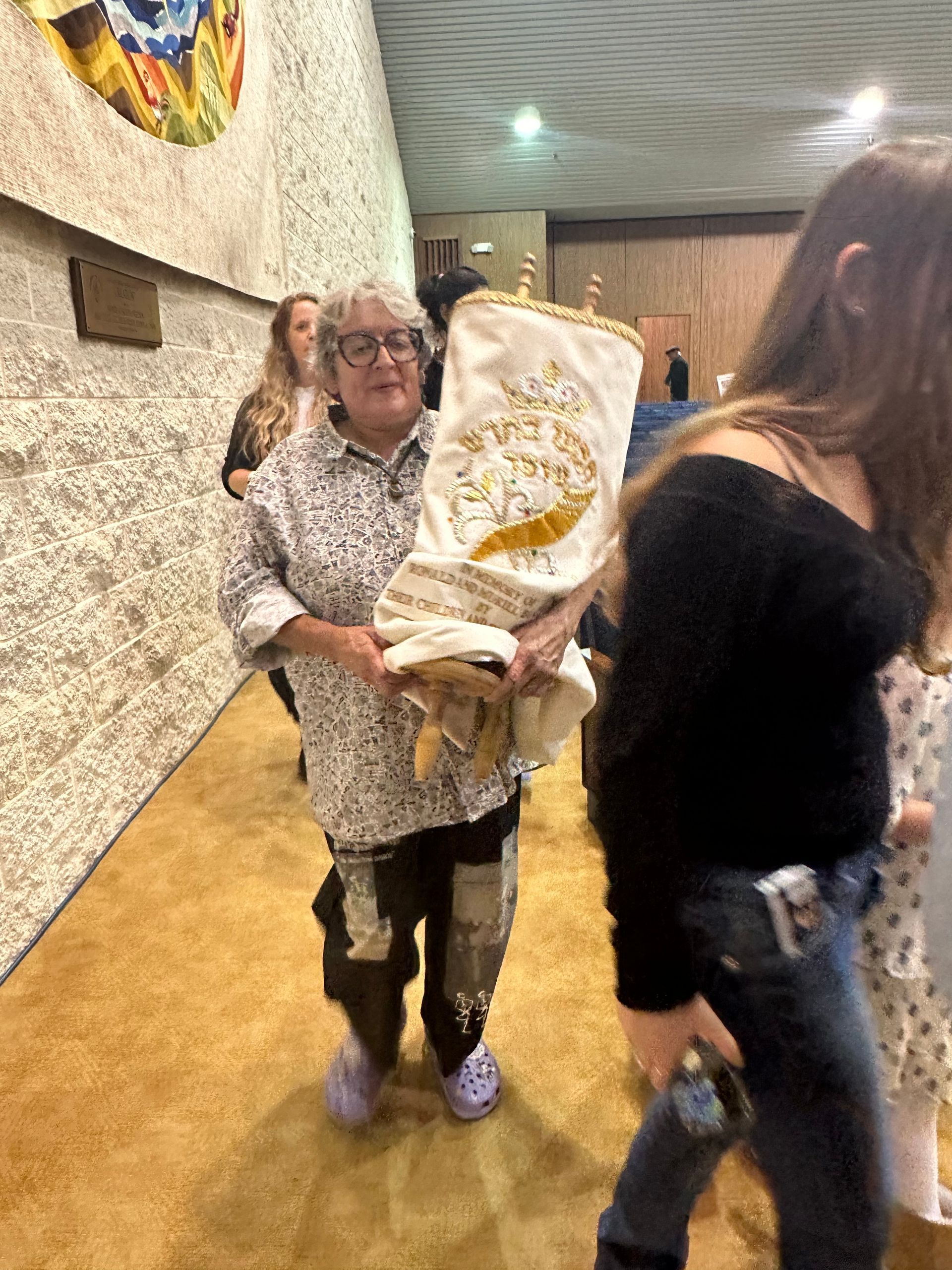 A young woman and an older woman are smiling for the camera.