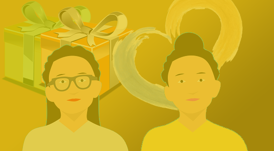 A couple of people standing next to each other in front of a gift box.