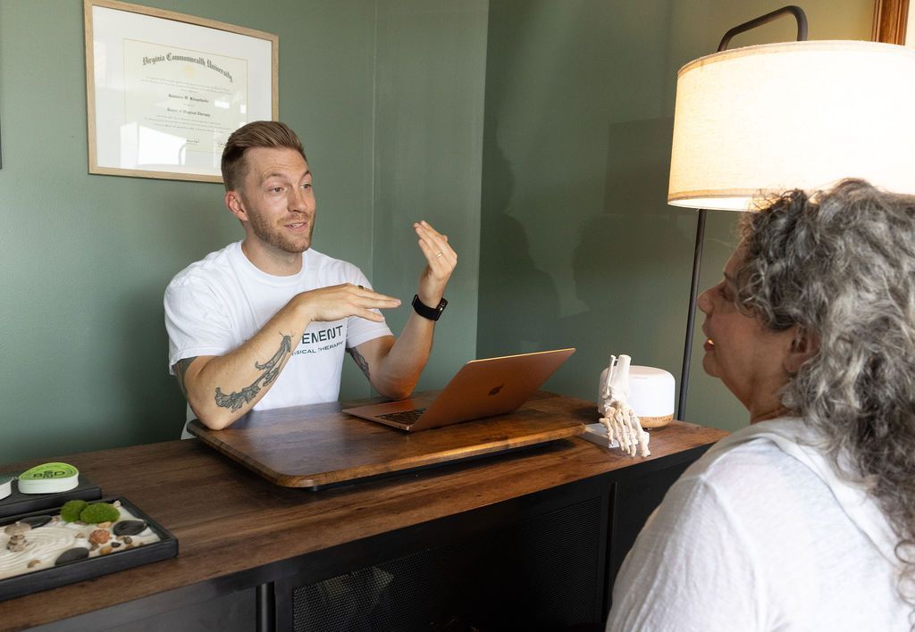 A man is getting his elbow examined by a doctor.