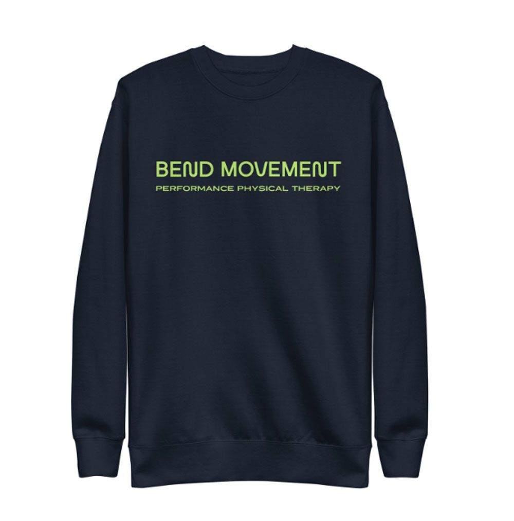 A man wearing a hat with a clock on it