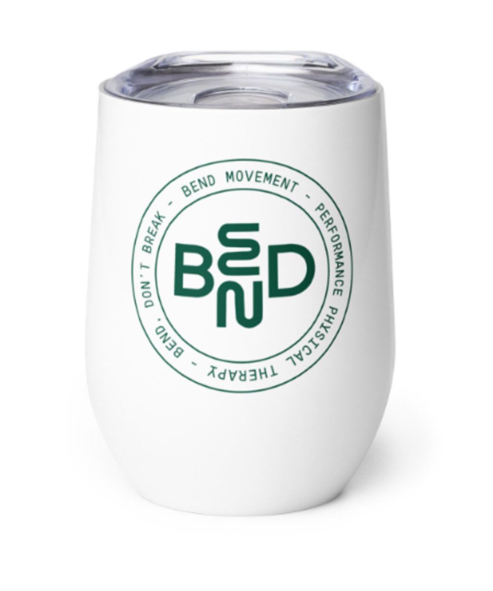 A white cup with a green bed logo on it